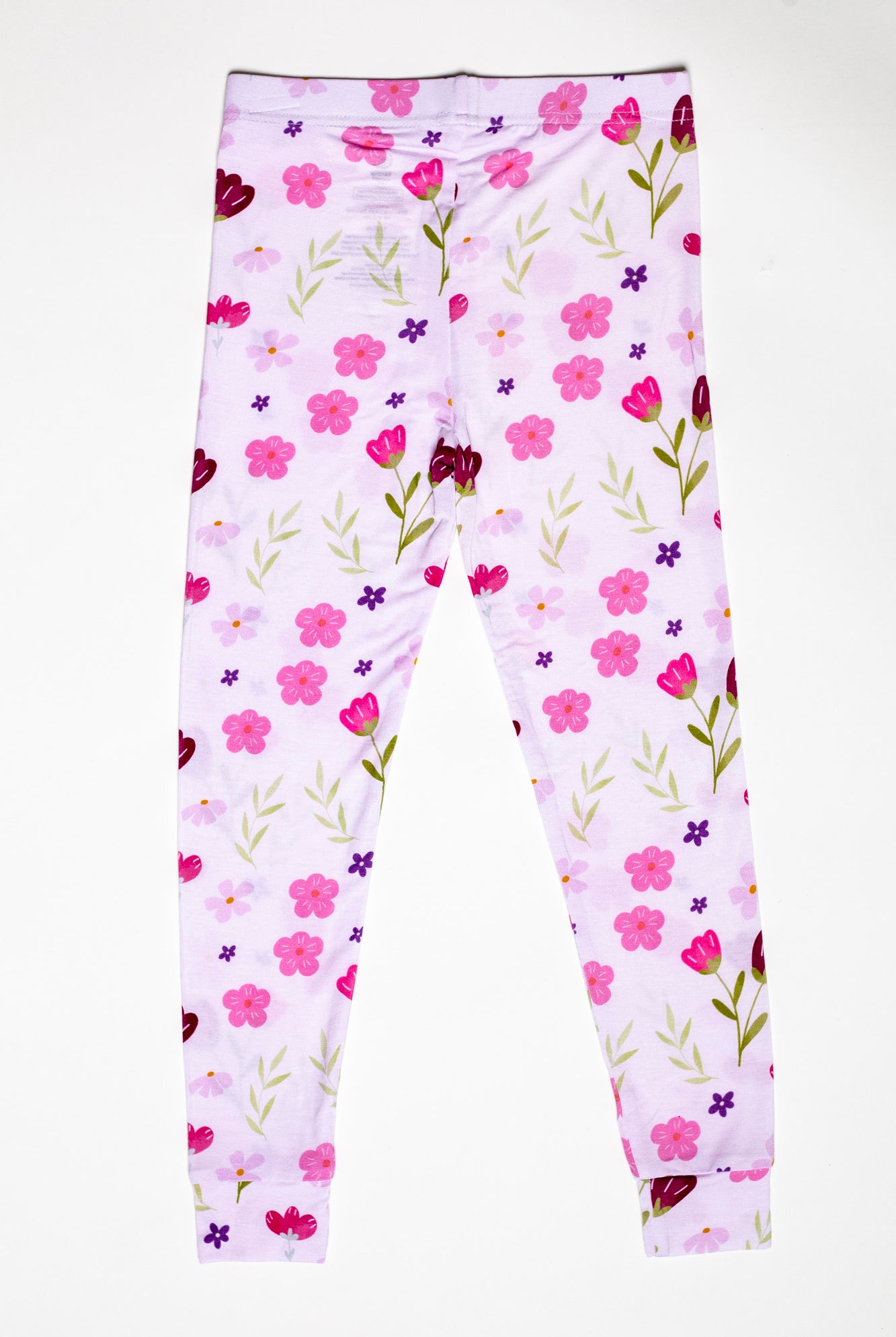 Lightweight and cozy kids floral pajama set, ideal for warm nights and lounging. Available in short sleeves and pants.