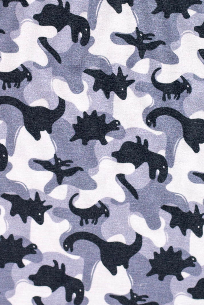 Earthly Threads kids' bamboo pajamas featuring a fun camo dinosaur print in gray, black, and white.