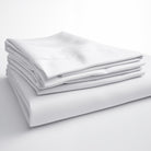 Neatly folded white bamboo sheets, displaying their lightweight and wrinkle-resistant design.