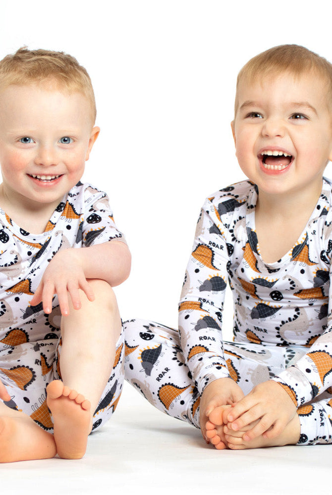 Cozy and breathable bamboo pajamas with a fun dinosaur pattern, designed to keep kids warm, comfy, and stylish at bedtime.