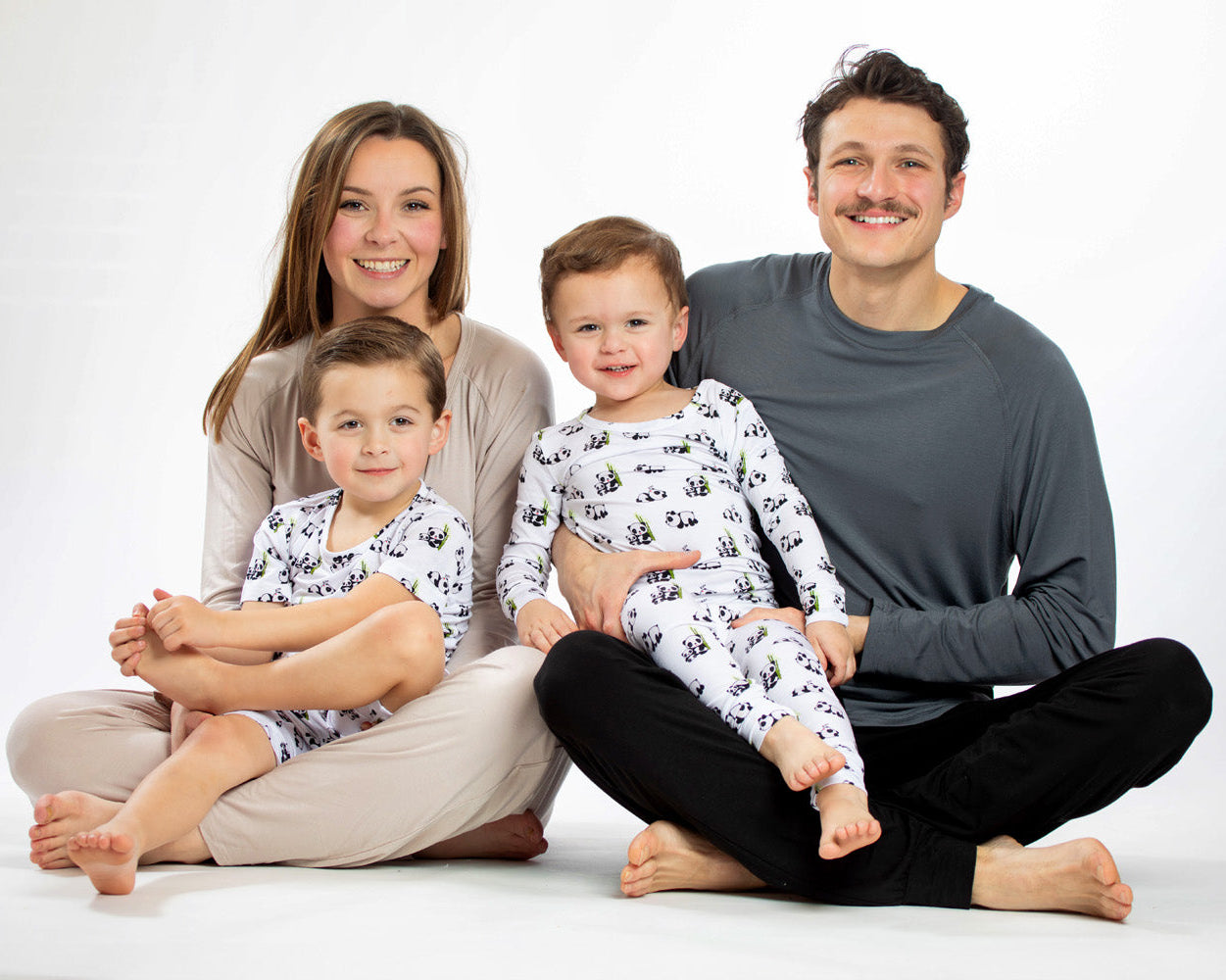 Hypoallergenic and antibacterial bamboo pajamas with pandas and bamboo print, perfect for kids with sensitive skin.