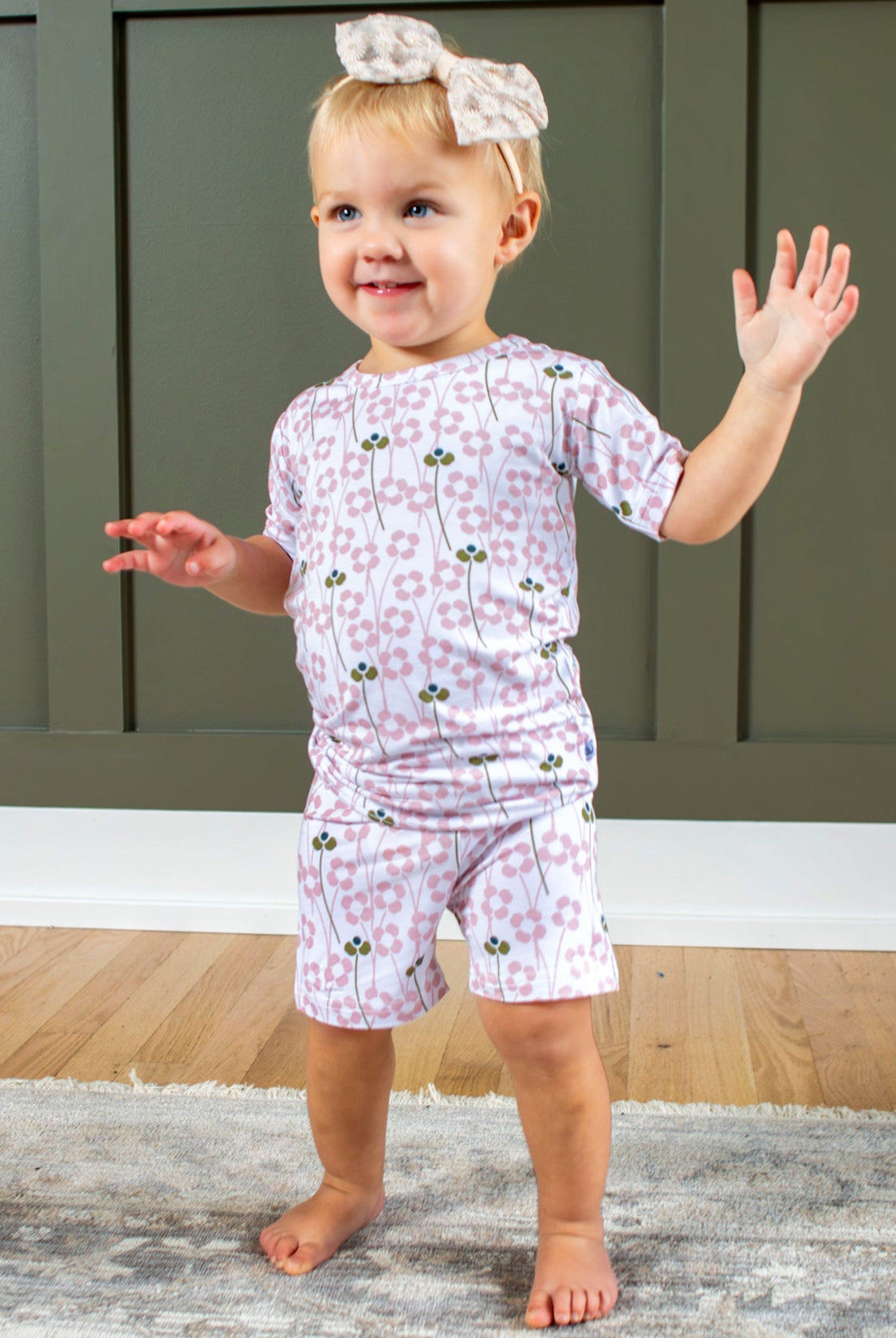 Earthly Threads floral pajama set, featuring delicate pink blossoms on a creamy backdrop, made from ultra-soft, breathable bamboo fabric, available in short or long separates for year-round comfort.