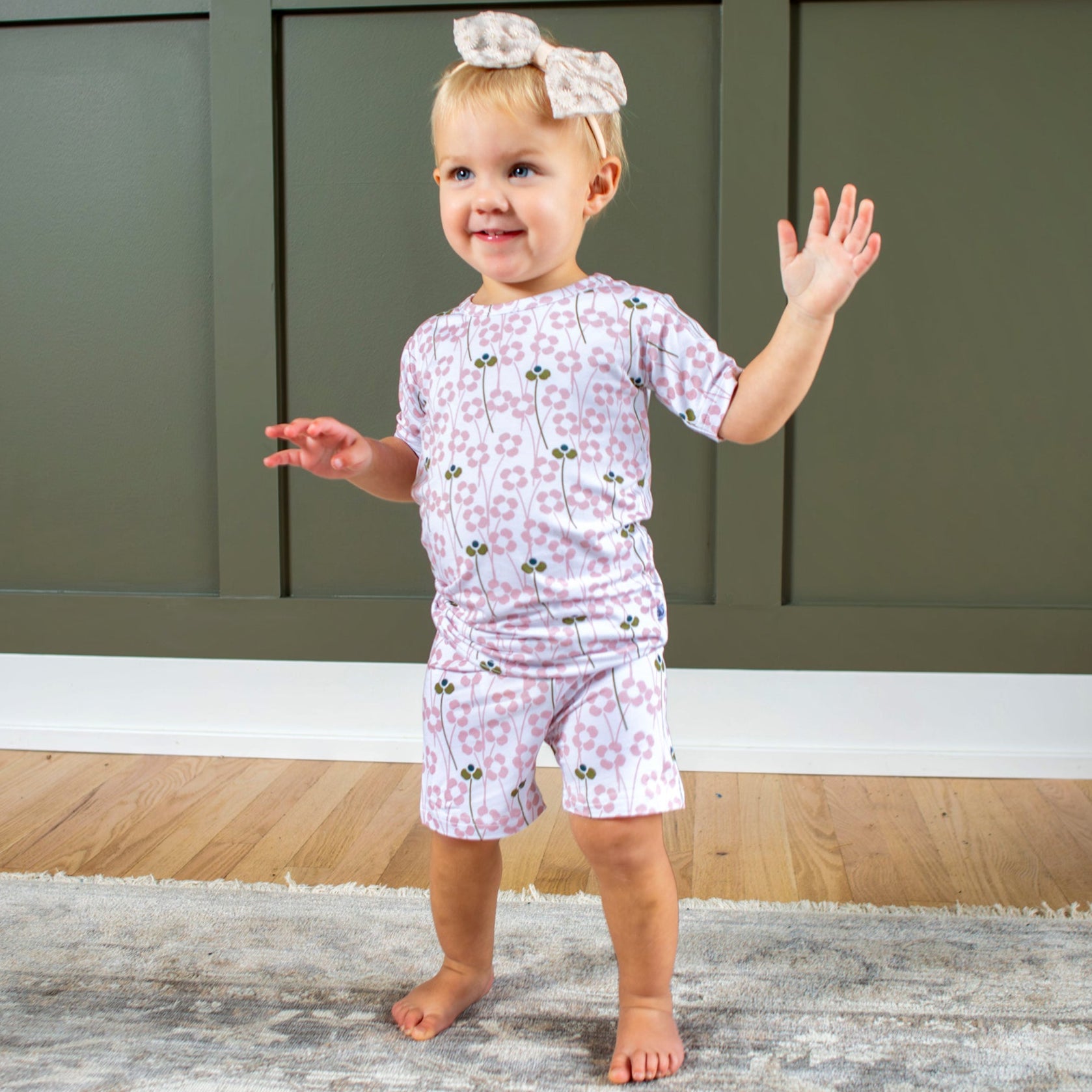 Earthly Threads floral pajama set, featuring delicate pink blossoms on a creamy backdrop, made from ultra-soft, breathable bamboo fabric, available in short or long separates for year-round comfort.