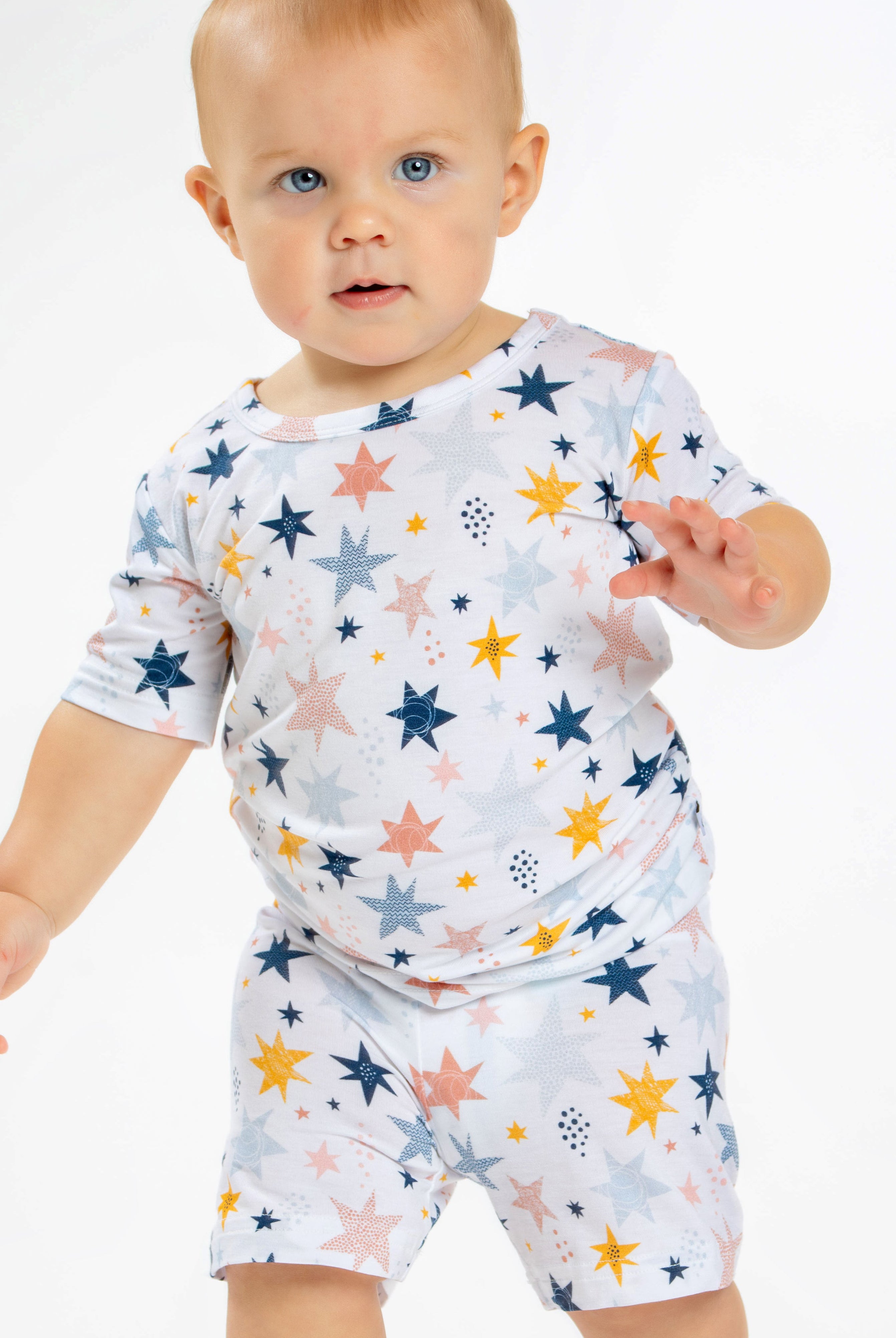 Earthly Threads kids short sleeve pajamas with a twinkling star and galaxy print, crafted with incredibly soft and soothing bamboo fabric.
