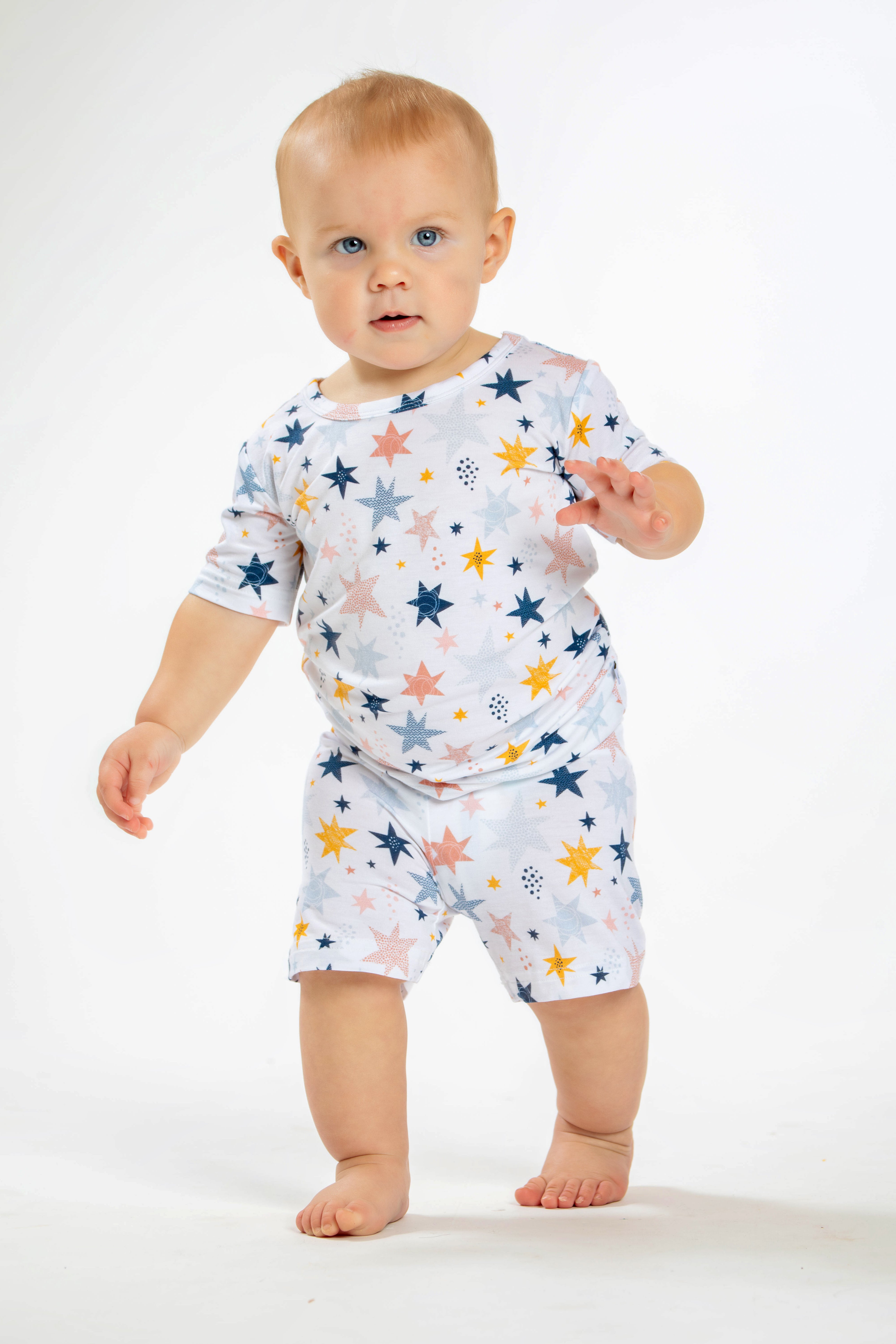 Earthly Threads kids short sleeve pajamas with a twinkling star and galaxy print, crafted with incredibly soft and soothing bamboo fabric.