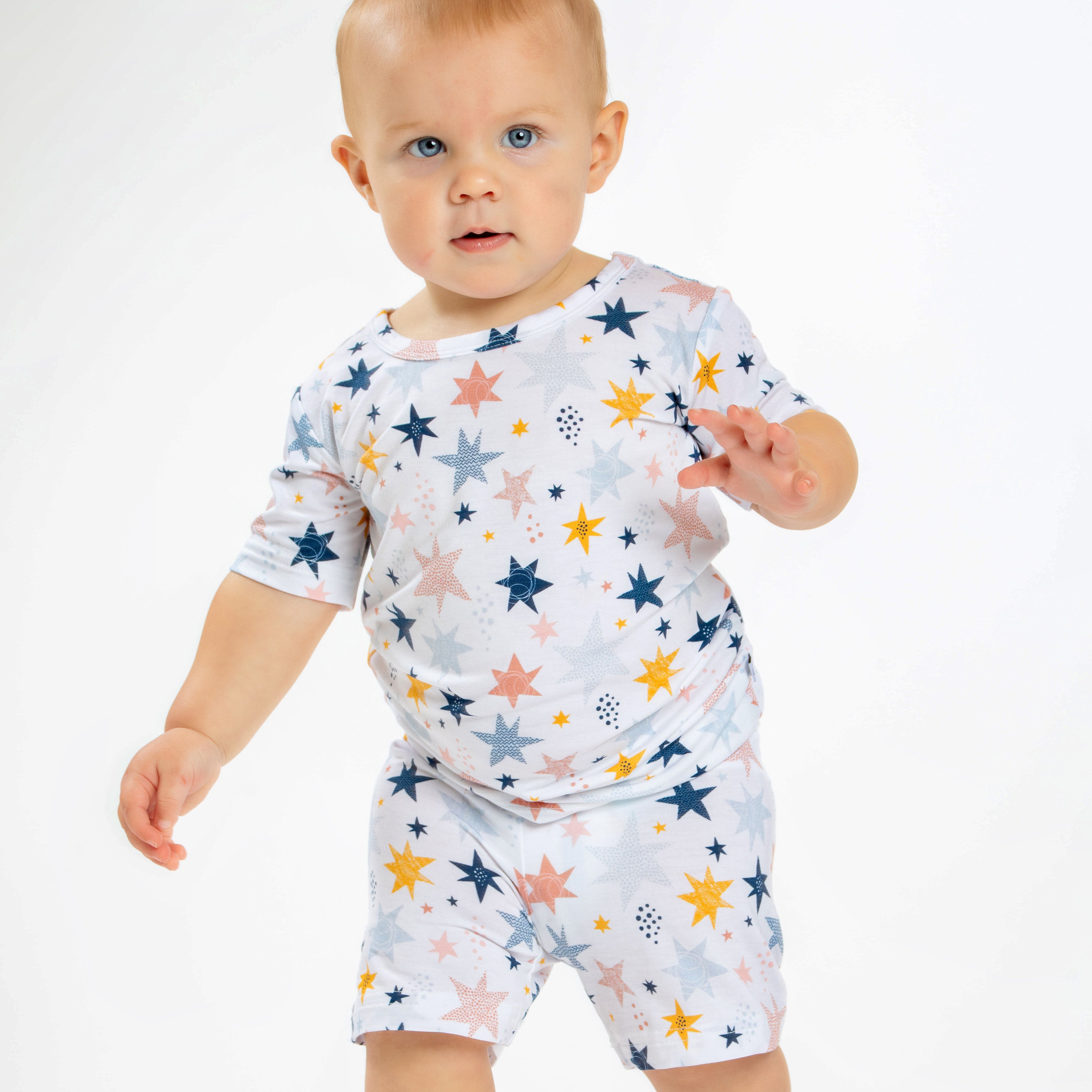 Earthly Threads kids short sleeve pajamas with a twinkling star and galaxy print, crafted with incredibly soft and soothing bamboo fabric.