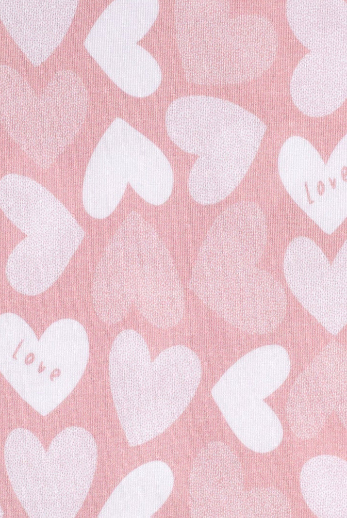 Ultra-soft bamboo kids’ pajamas featuring a sweet pattern of hearts and love lettering.