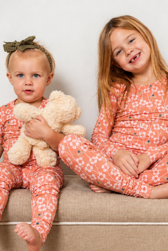 Bright and whimsical orange blossom bamboo pajama set with soft, breathable fabric for dreamy comfort. Available in short or long sleeves with pants.