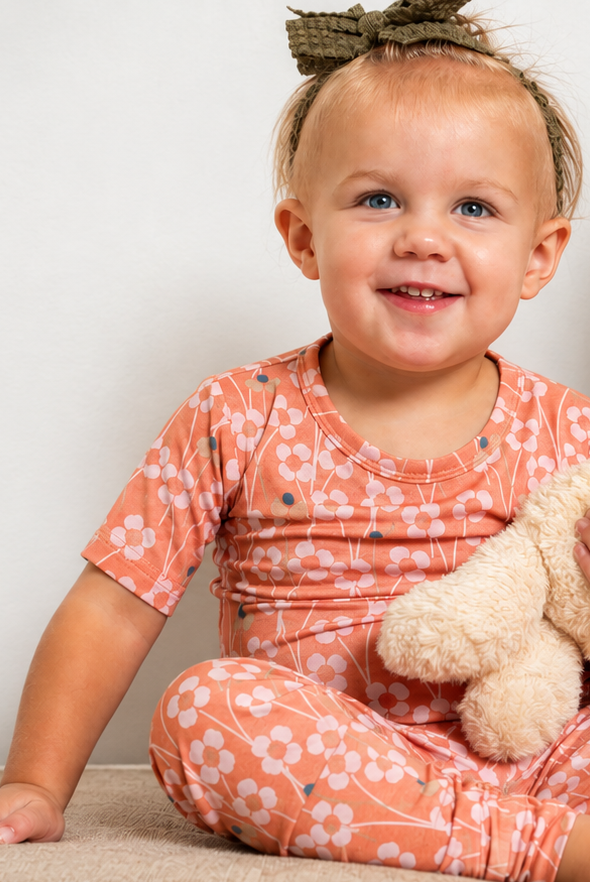 Orange Blossom short sleeve bamboo pajamas from Earthly Threads is the perfect happy neutral for your little daydream believer.