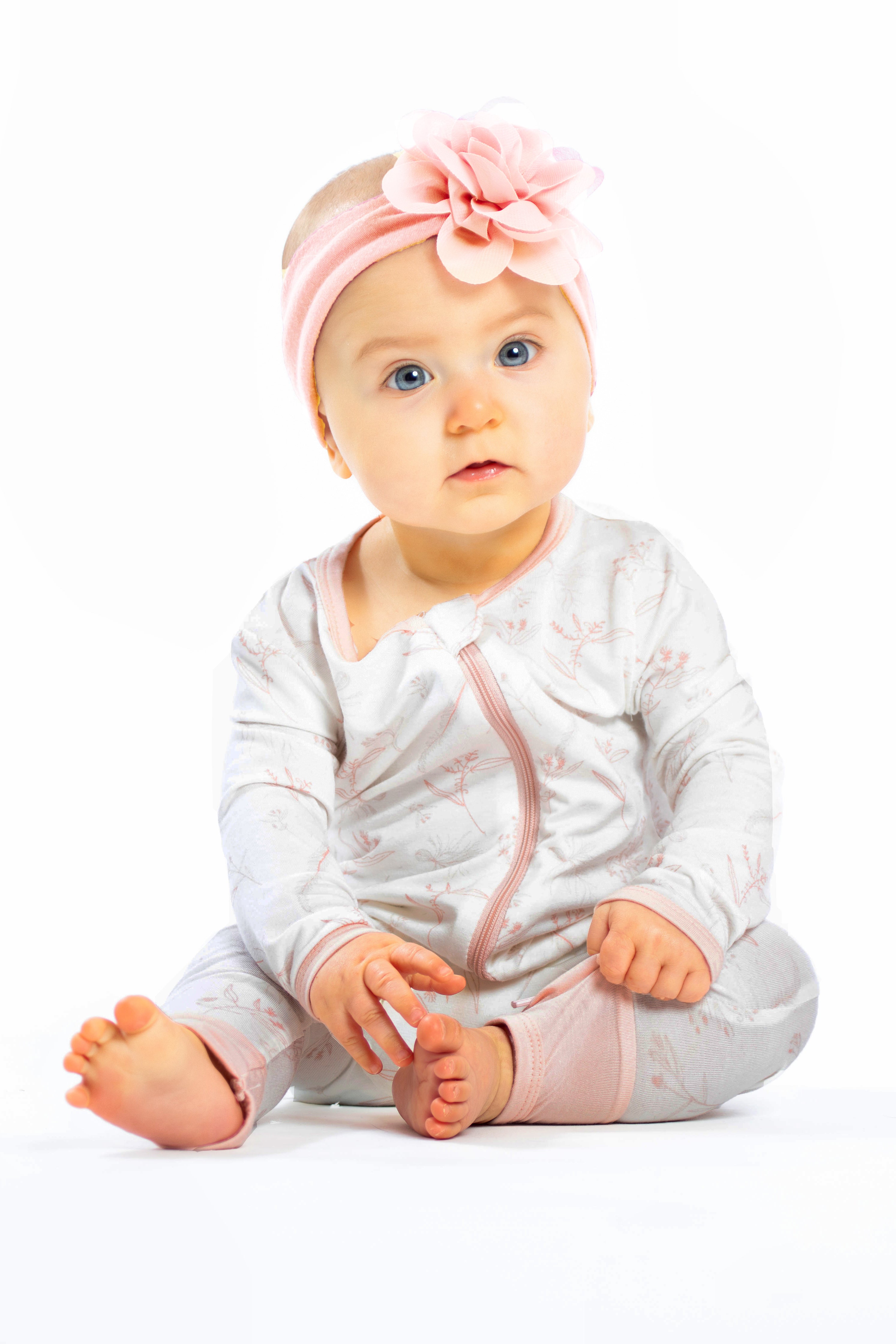 Buttery soft bamboo pink floral zip sleeper for baby.