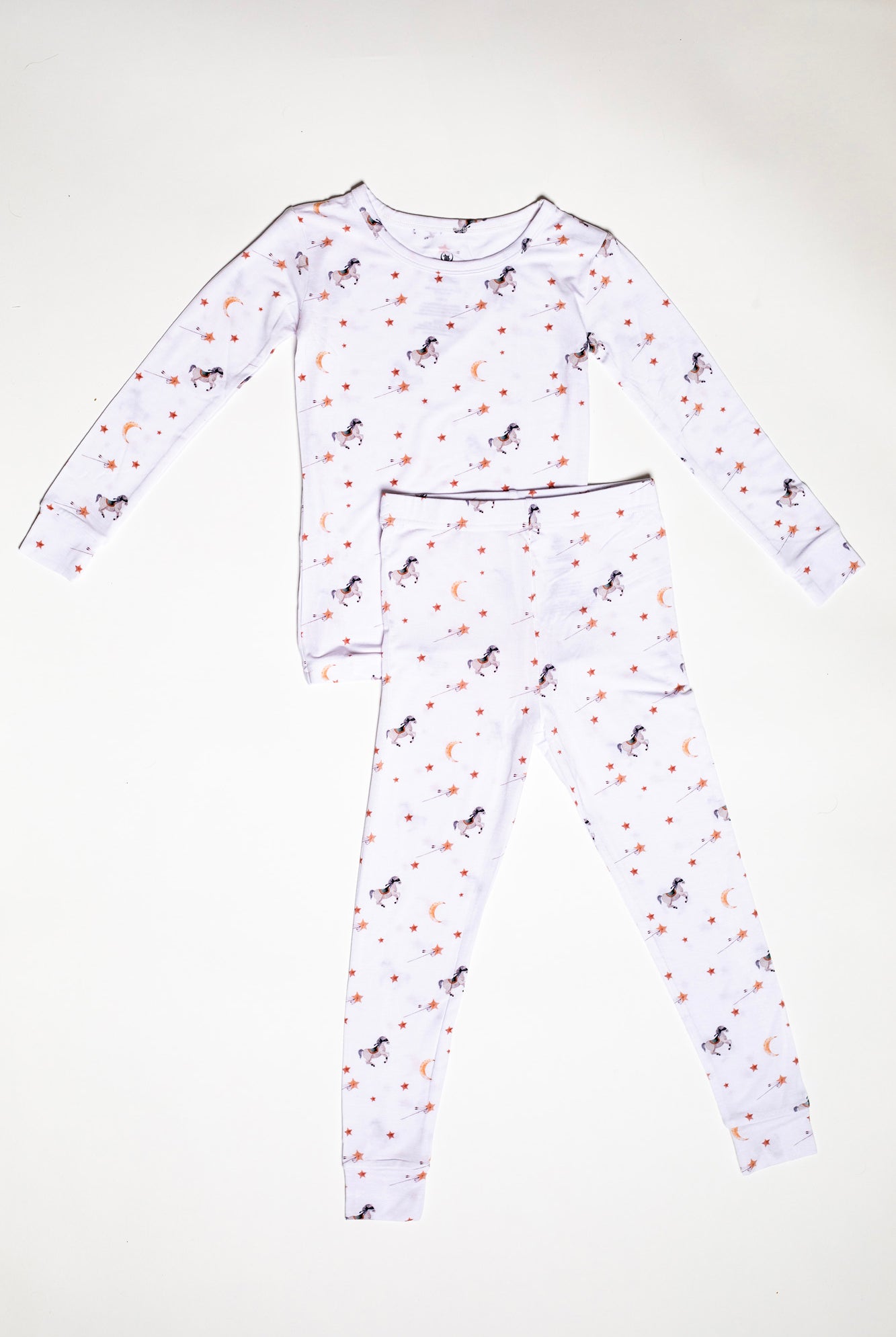 Cozy long sleeve bamboo pajama set featuring playful masked ponies, twinkling stars, and crescent moons for a magical bedtime.