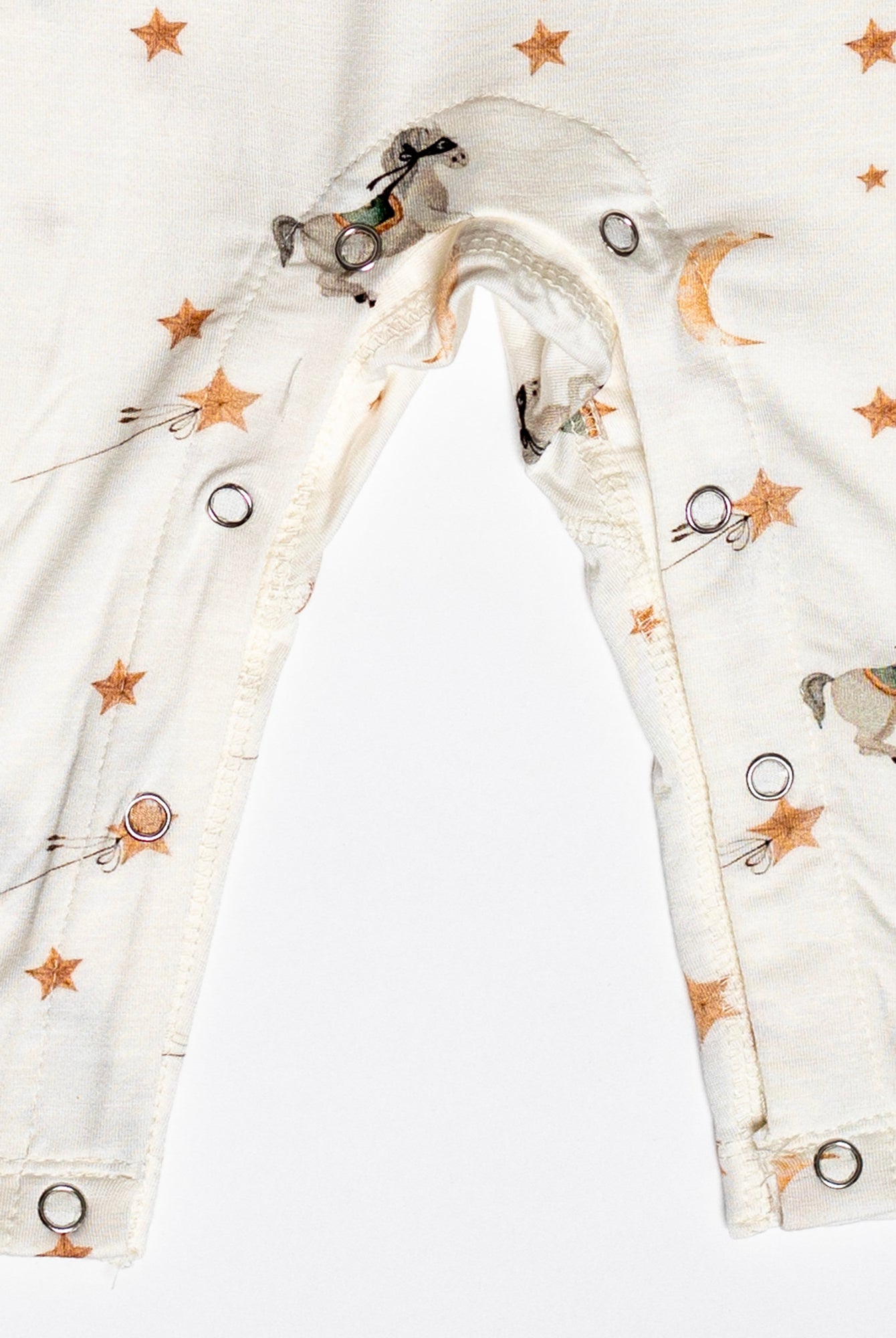 One-piece snap romper with an enchanting pony print and buttery-soft bamboo fabric.