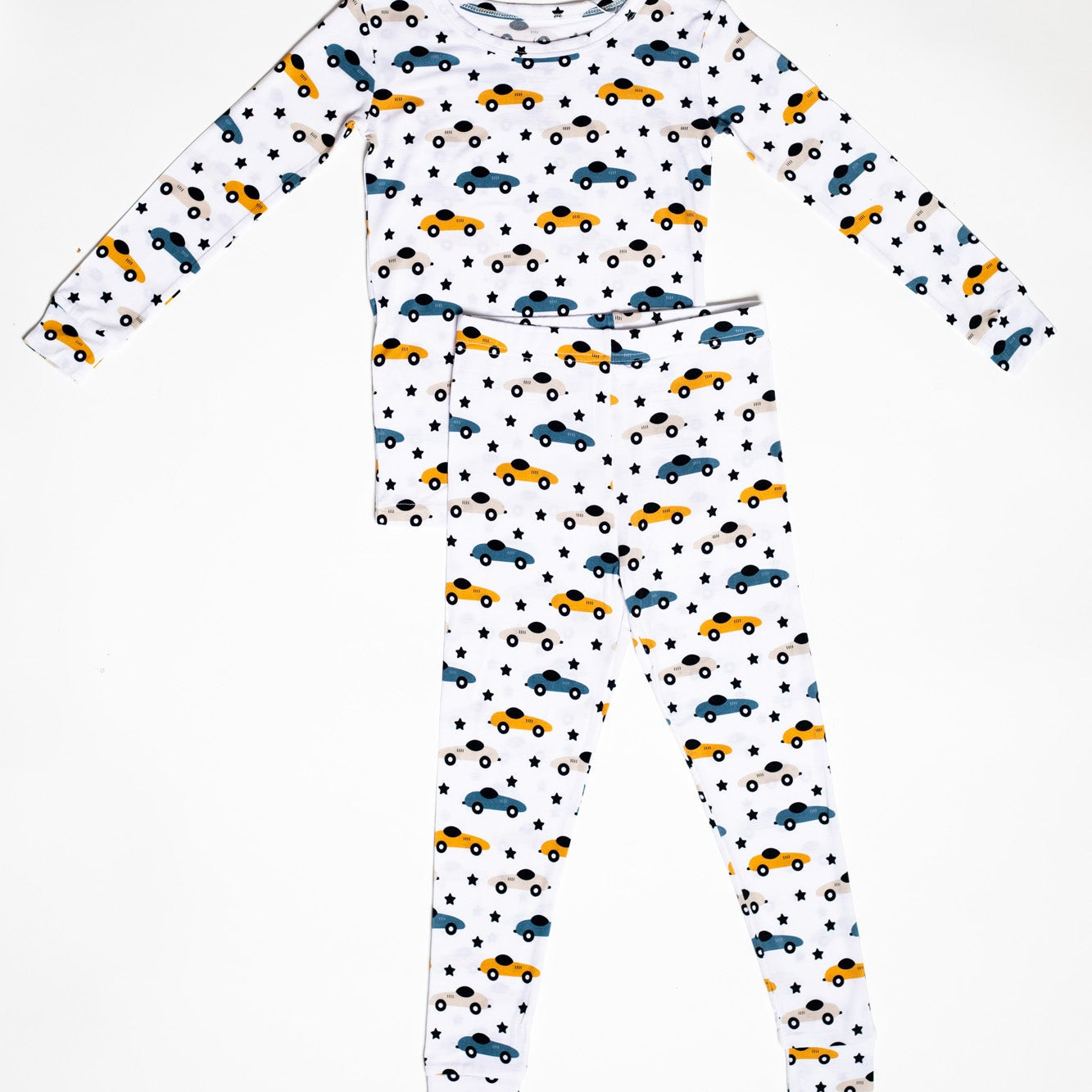 Race car bamboo pajama set with a fun pattern of race cars and shooting stars, designed for cozy, all-night comfort.