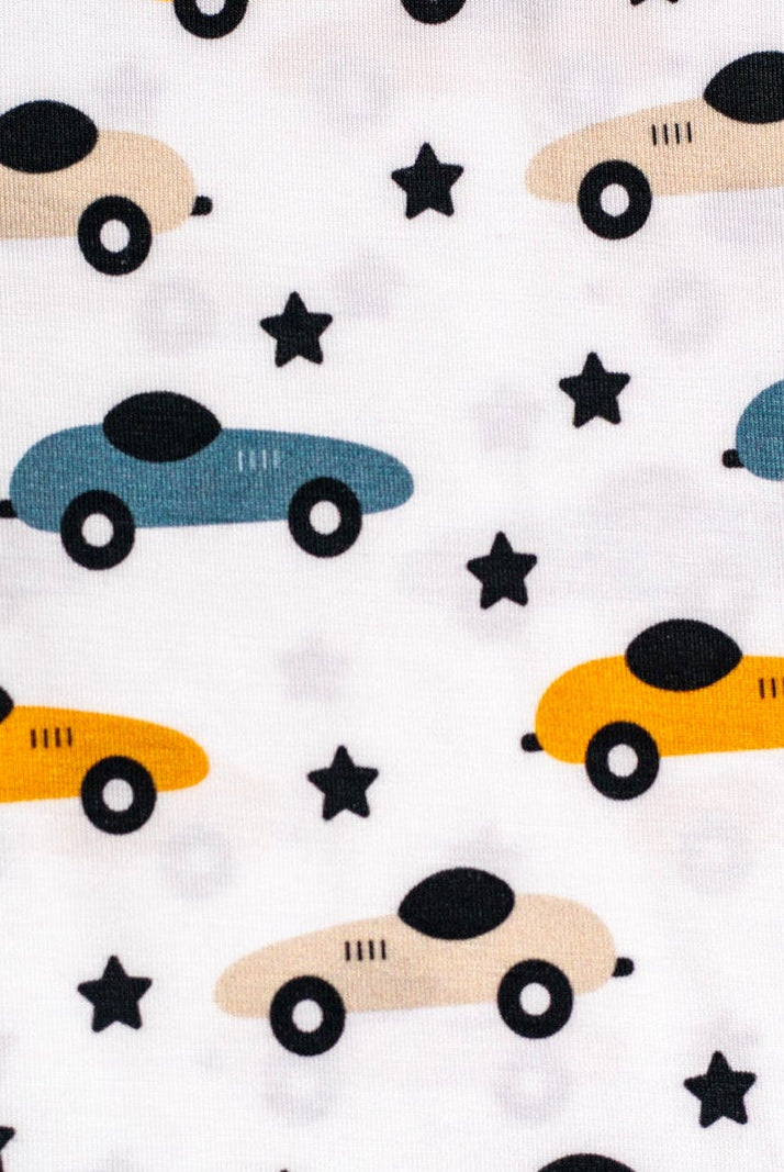 Playful bamboo pajama set with colorful race cars and twinkling stars, perfect for little speedsters.