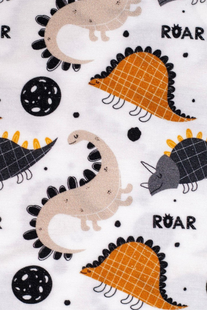 Ultra-soft and hypoallergenic bamboo pajamas with a cute dinosaur print and "ROAR" lettering, designed for warmth, breathability, and bedtime fun.