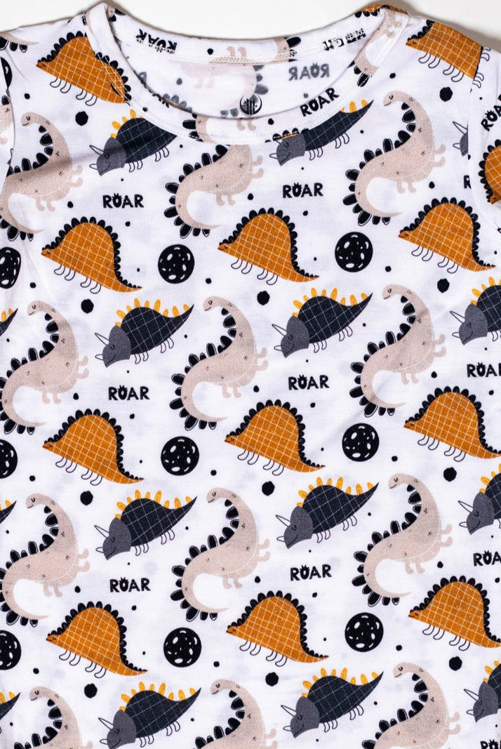 Eco-friendly and moisture-wicking bamboo pajama set with a roaring dinosaur design.
