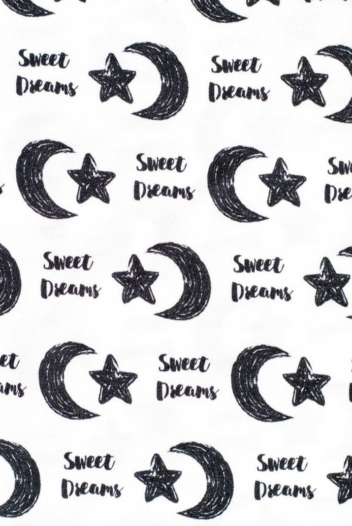 Earthly Threads kids’ bamboo pajamas designed for comfort with a gentle, celestial print featuring moons, stars, and "Sweet Dreams".