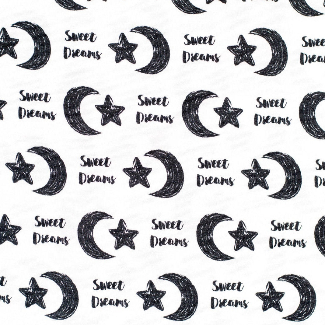Earthly Threads kids’ bamboo pajamas designed for comfort with a gentle, celestial print featuring moons, stars, and "Sweet Dreams".