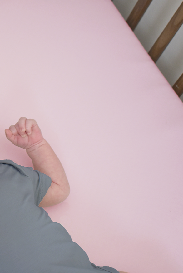 Earthly Threads Organic Bamboo Crib Sheet in soft pink, made for delicate skin and eczema-prone babies. Made from 100% certified organic bamboo.