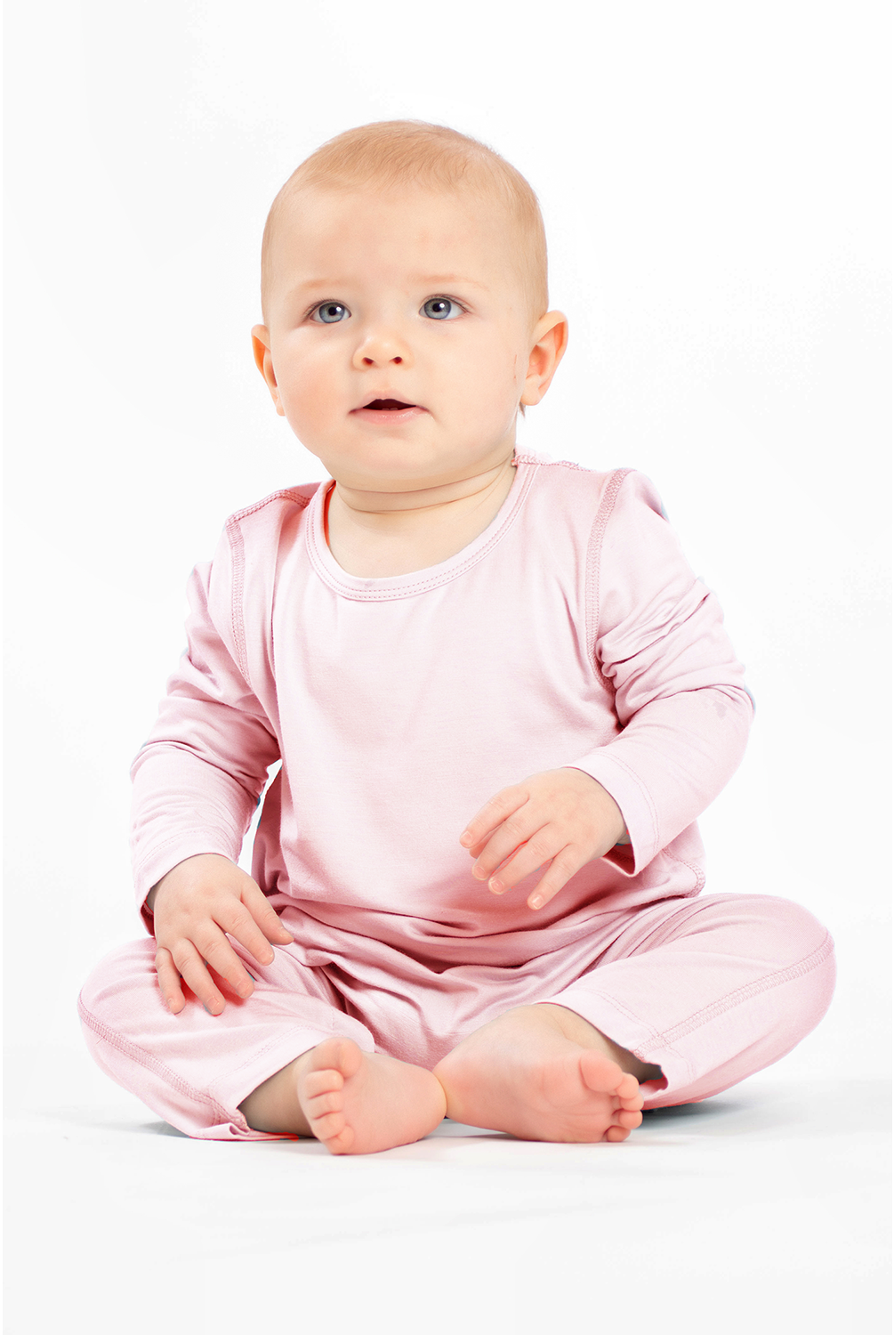 Pink bamboo snap romper crafted for comfort, convenience, and eco-conscious families.