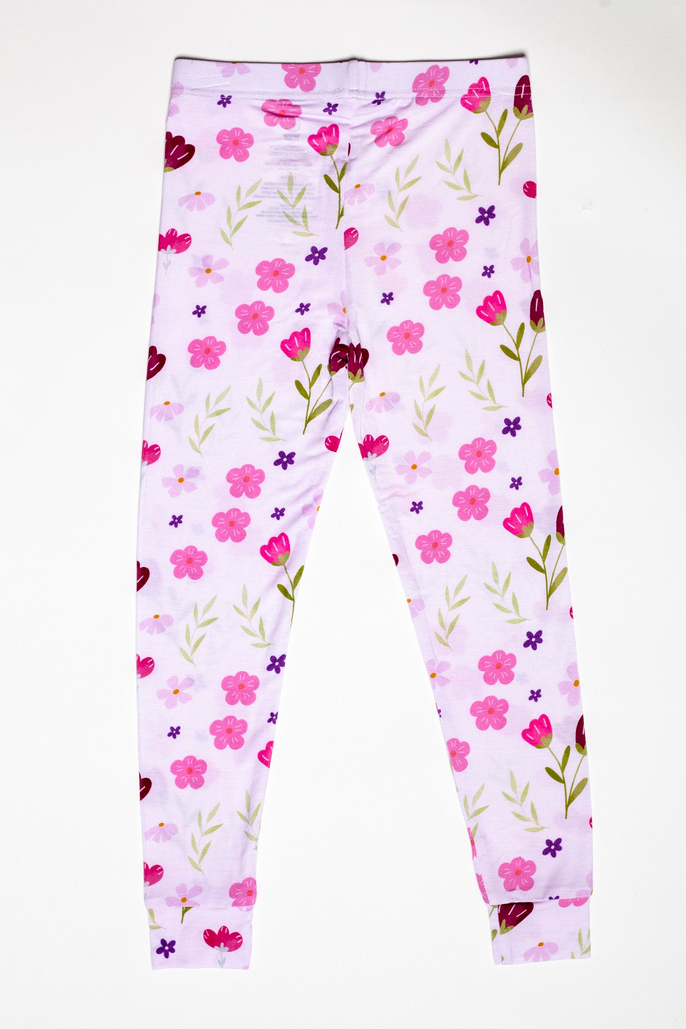 Lightweight and cozy kids floral pajama set, ideal for warm nights and lounging. Available in short sleeves and pants.