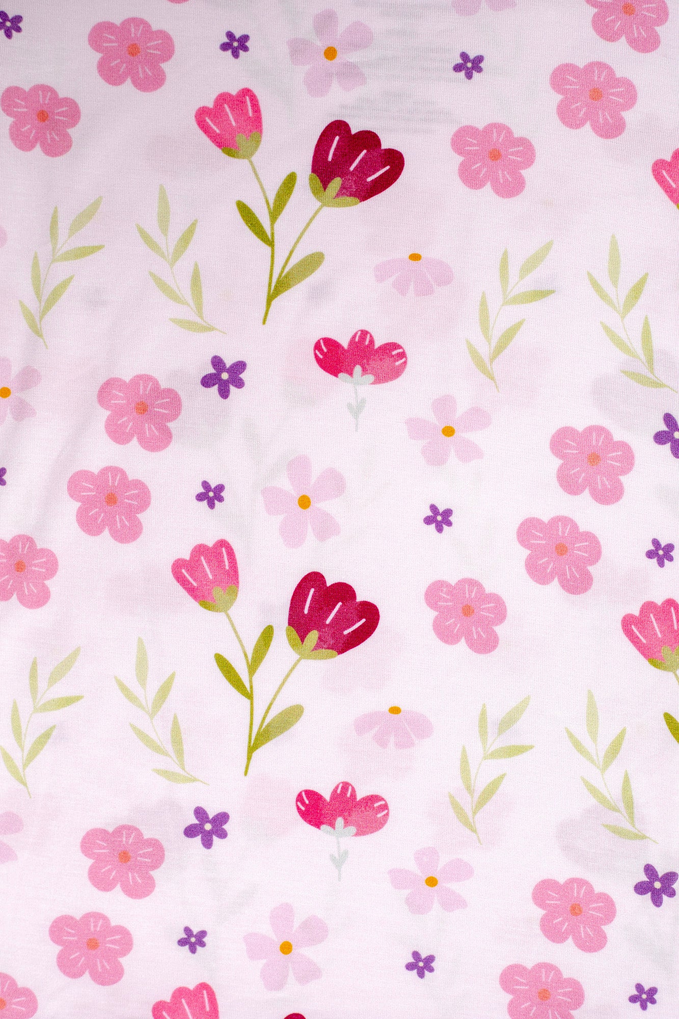 Charming pink flower-print bamboo pajamas for girls, designed for comfort and style.