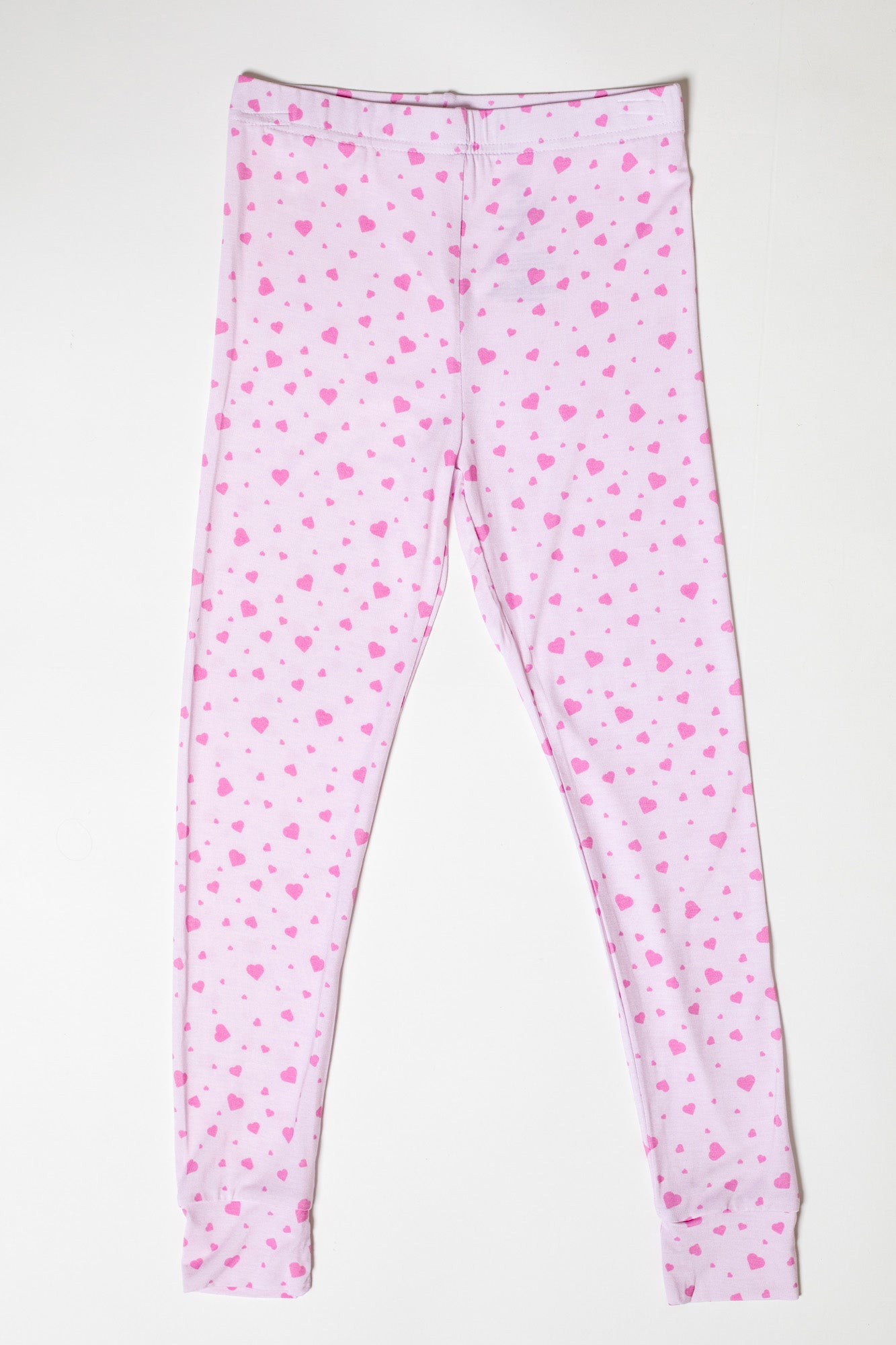 Lightweight and breathable bamboo pajamas with a pink heart design, perfect for sleep or lounging.