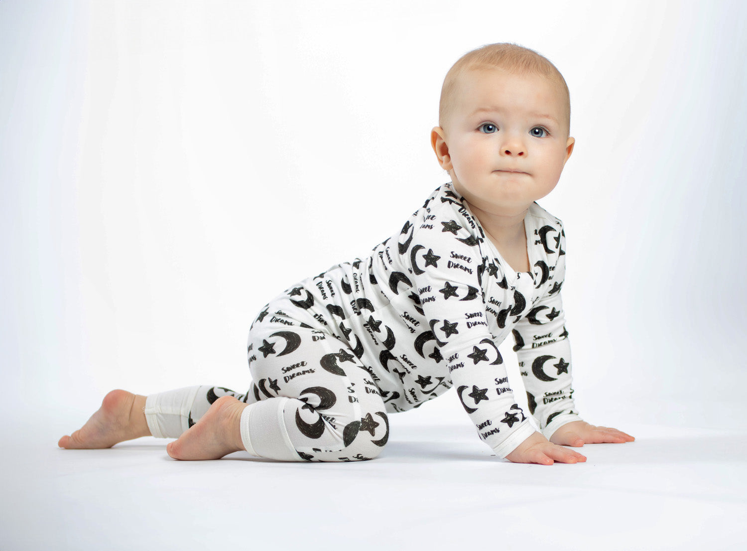 Celestial-themed baby romper, made from eco-friendly bamboo with moisture-wicking and softness for all-night coziness.