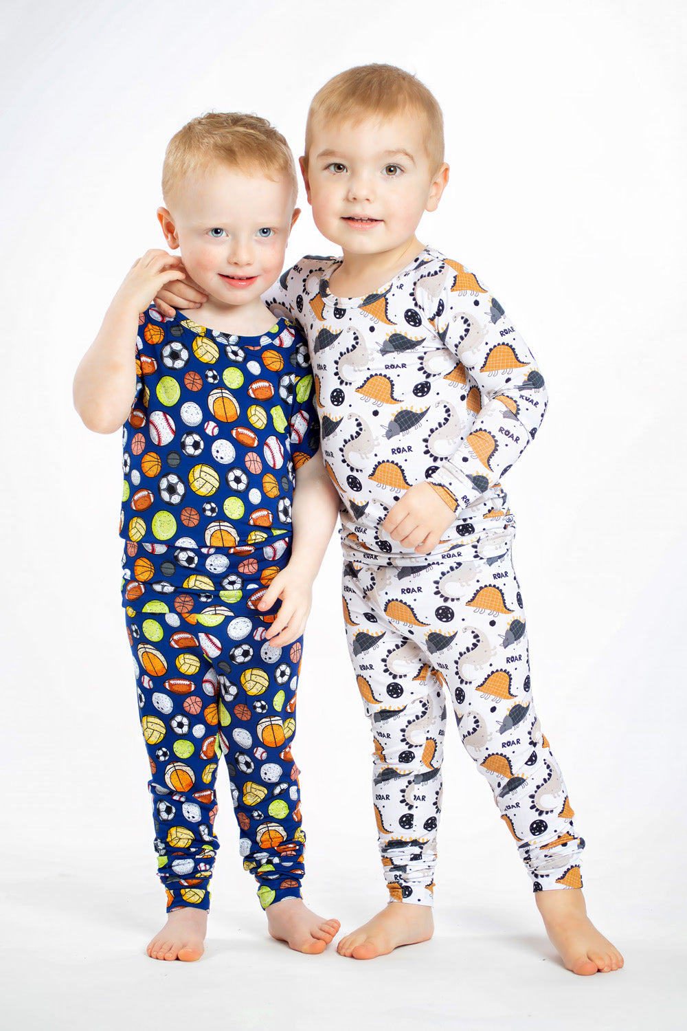 Earthly Threads All Star bamboo pajama set is perfect for your little sport with football, basketball, tennis, soccer, volleyball, and baseball pattern on a blue background