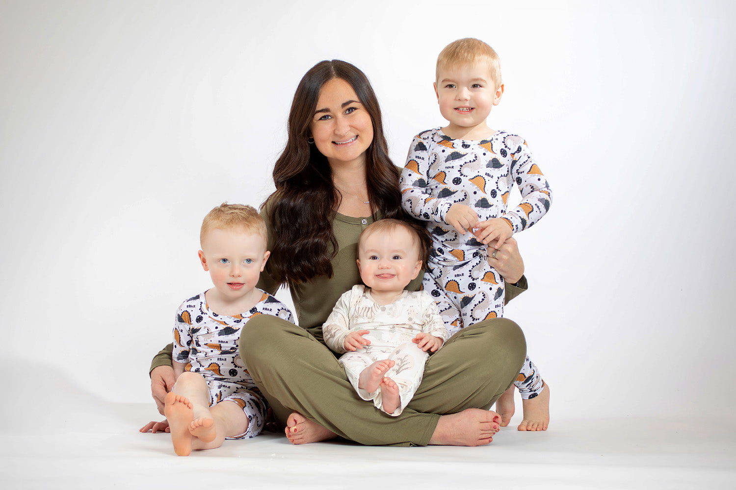Soft and stretchy long-sleeve pajama set with a dinosaur theme, crafted from bamboo for gentle comfort on sensitive skin.