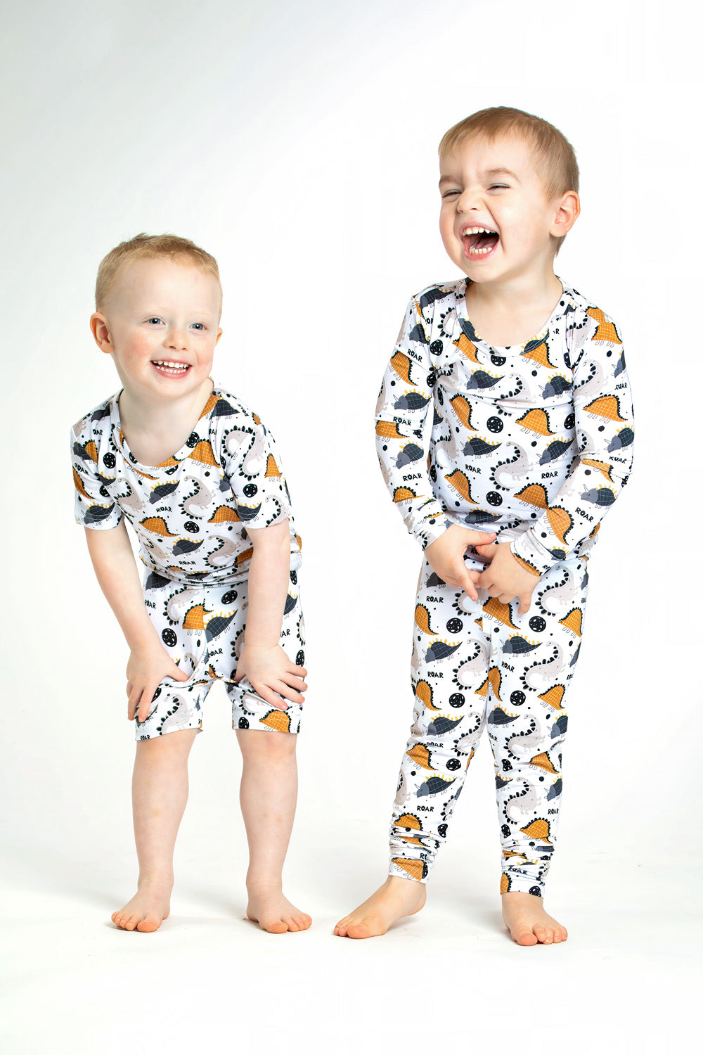 Earthly Threads Roaring Dinosaur Pajama Set, featuring playful dinosaur prints and “ROAR” lettering on a soft bamboo long-sleeve top and matching pants.