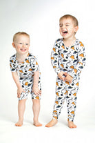 Earthly Threads Roaring Dinosaur Pajama Set, featuring playful dinosaur prints and “ROAR” lettering on a soft bamboo long-sleeve top and matching pants.
