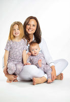 Classic rose-patterned bamboo kids’ pajamas with short sleeves and cozy, breathable pants.