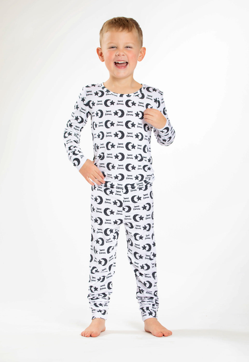 Earthly Threads Sweet Dreams bamboo pajama set with a celestial pattern of stars, moons, and soft lettering.