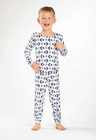Earthly Threads Sweet Dreams bamboo pajama set with a celestial pattern of stars, moons, and soft lettering.