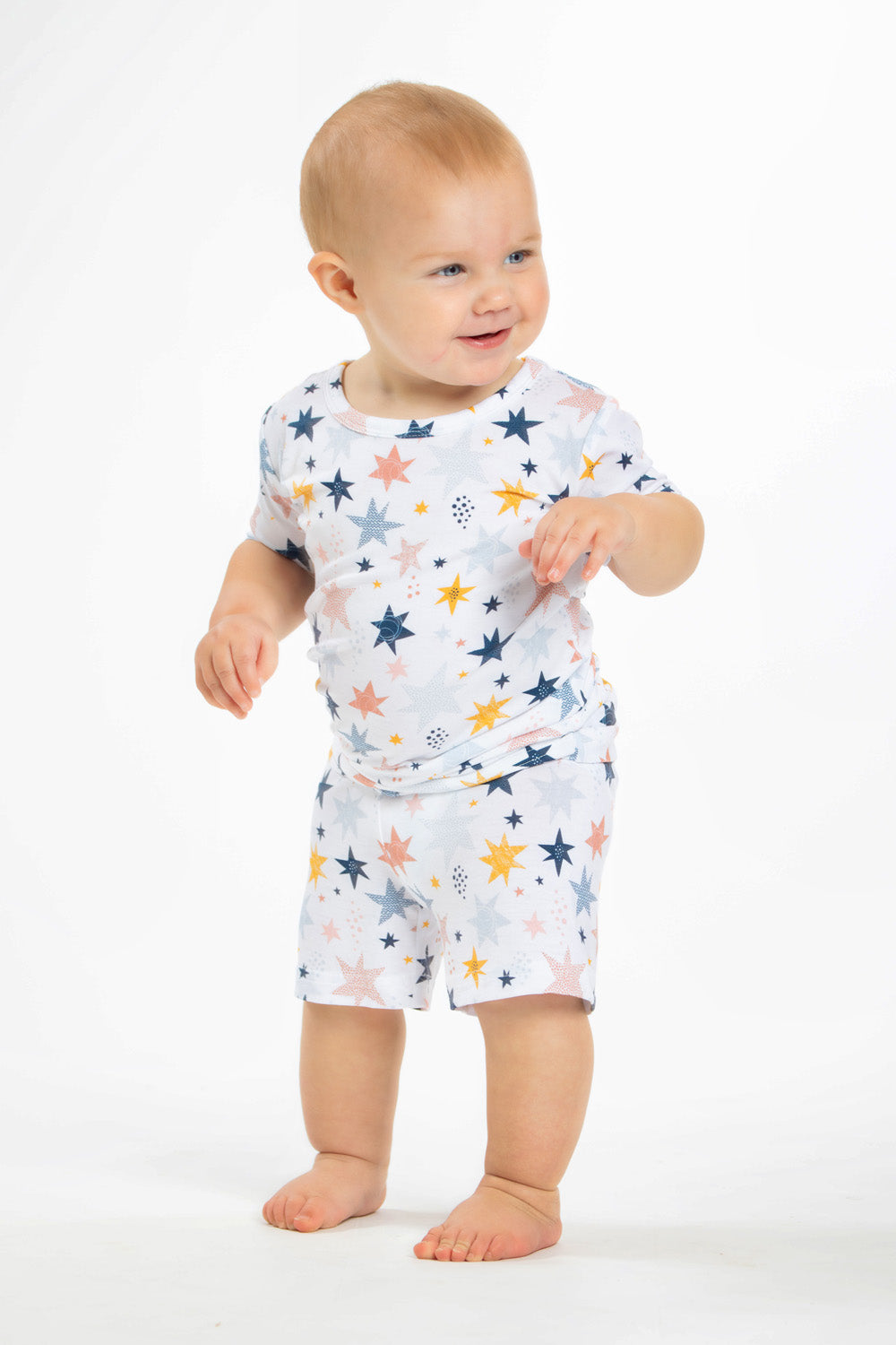 Earthly Threads kids short sleeve pajamas with a twinkling star and galaxy print, crafted with incredibly soft and soothing bamboo fabric.