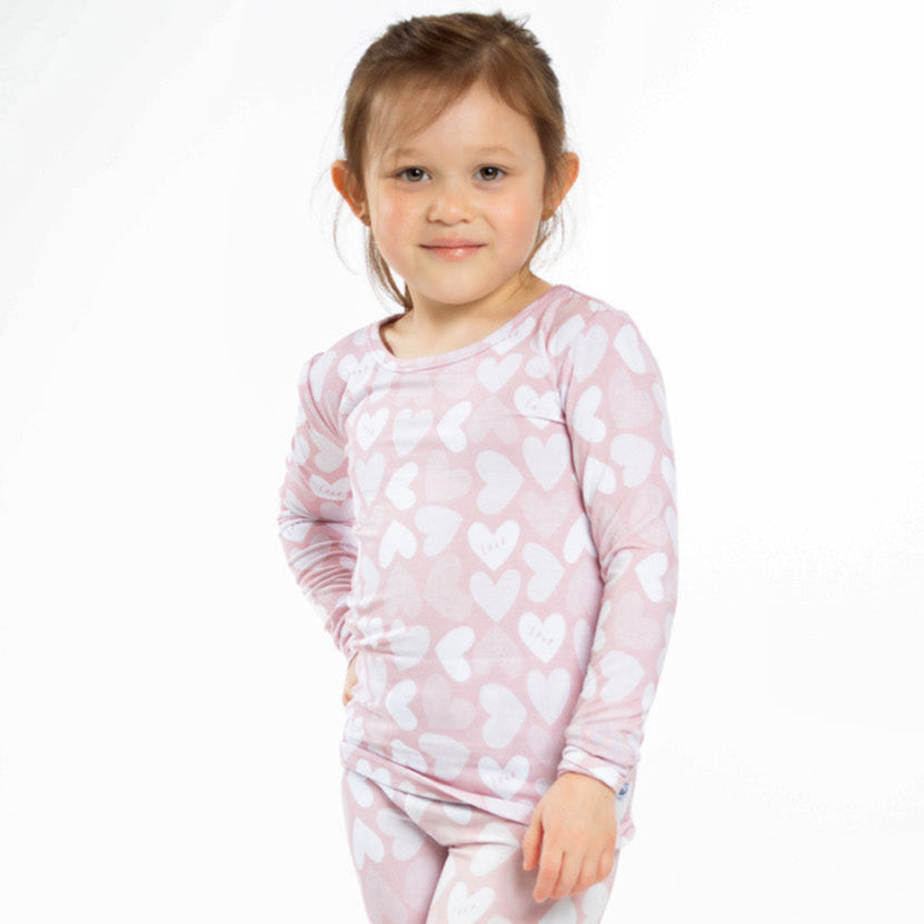 Earthly Threads Full of Heart bamboo pajama set with pink and white hearts and soft "Love" lettering.