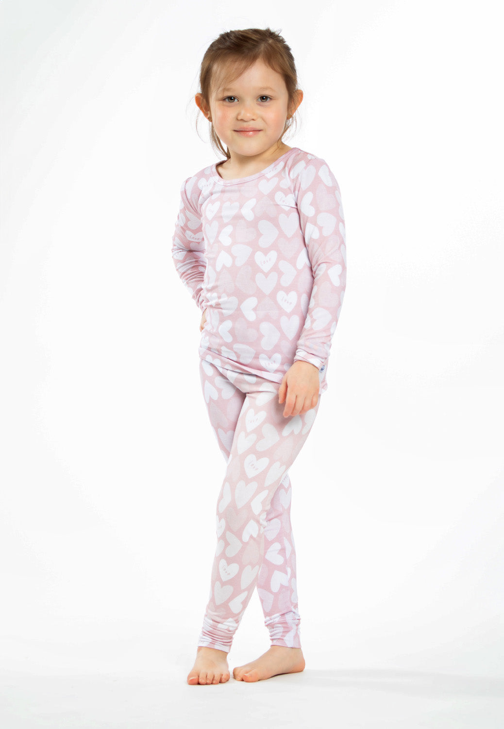 Earthly Threads Full of Heart bamboo pajama set with pink and white hearts and soft "Love" lettering.