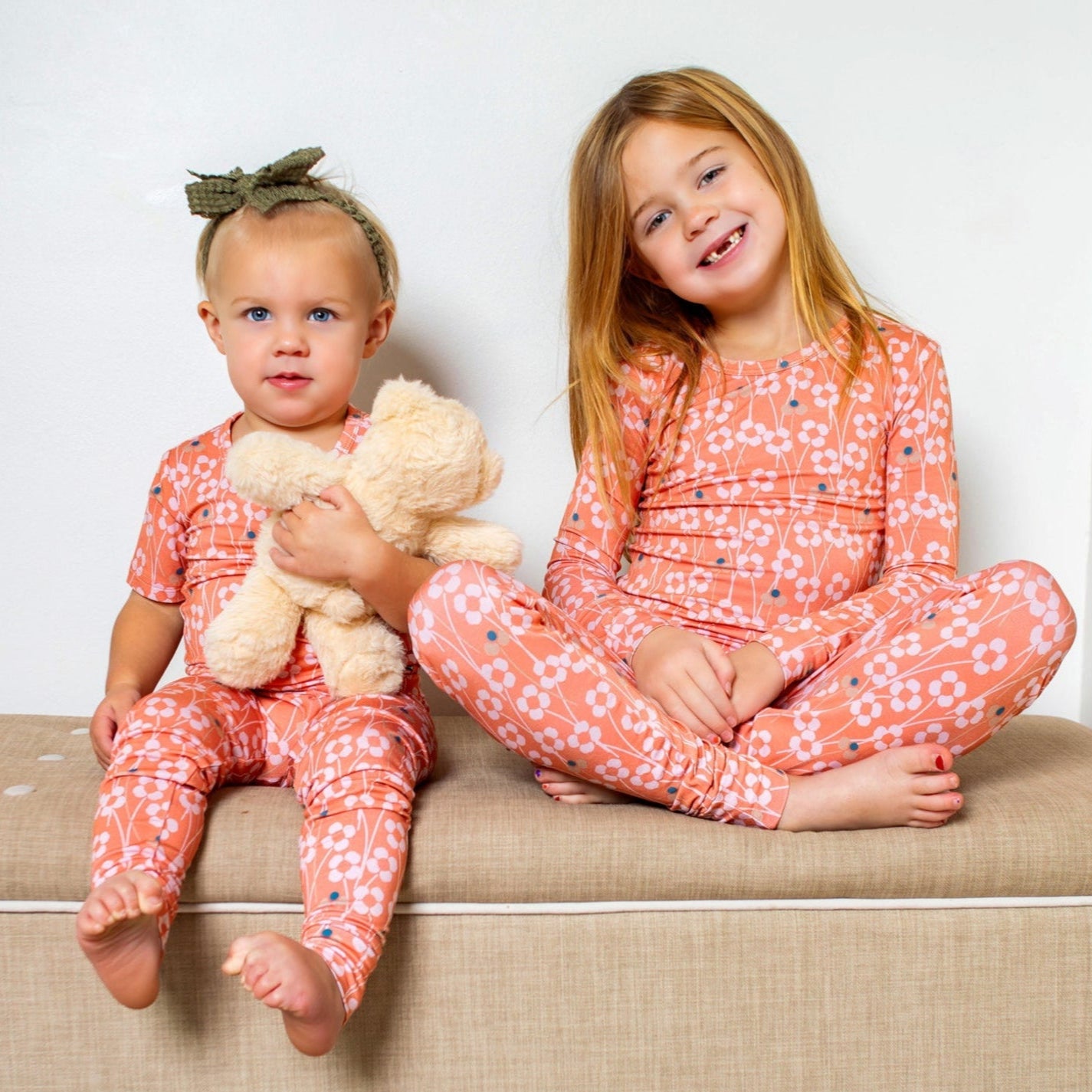 Bright and whimsical orange blossom bamboo pajama set with soft, breathable fabric for dreamy comfort. Available in short or long sleeves with pants.