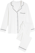Earthly Threads bamboo pajama set featuring a button-down long-sleeve top with elegant contrast piping and tapered pants with pockets for effortless comfort. Available in basic, trendy colors like true black, true navy, and bright white.