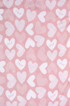 Ultra-soft bamboo kids’ pajamas featuring a sweet pattern of hearts and love lettering.