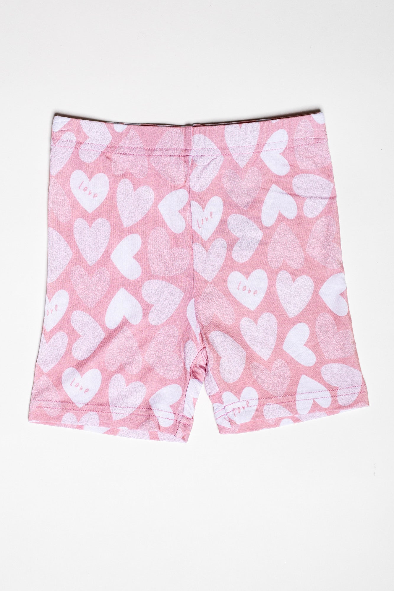 Organic bamboo short sleeve pajama set with matching shorts, featuring an adorable, pink heart print.