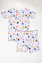 Buttery soft bamboo short sleeve pajama set with a cosmic print, ideal for nighttime adventures for your little ones.