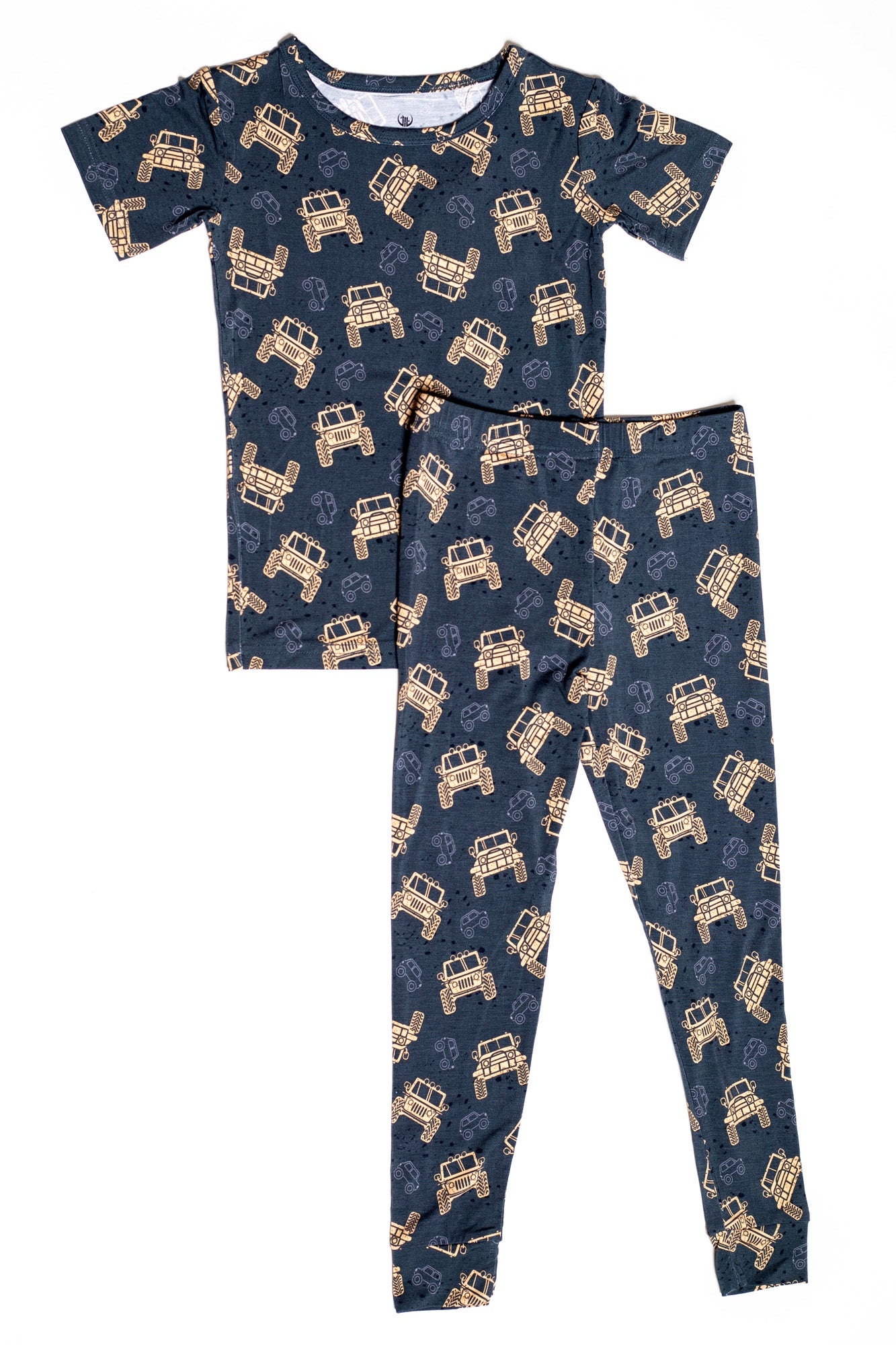 Two-piece short sleeve pajama set with rugged trucks for little explorers.