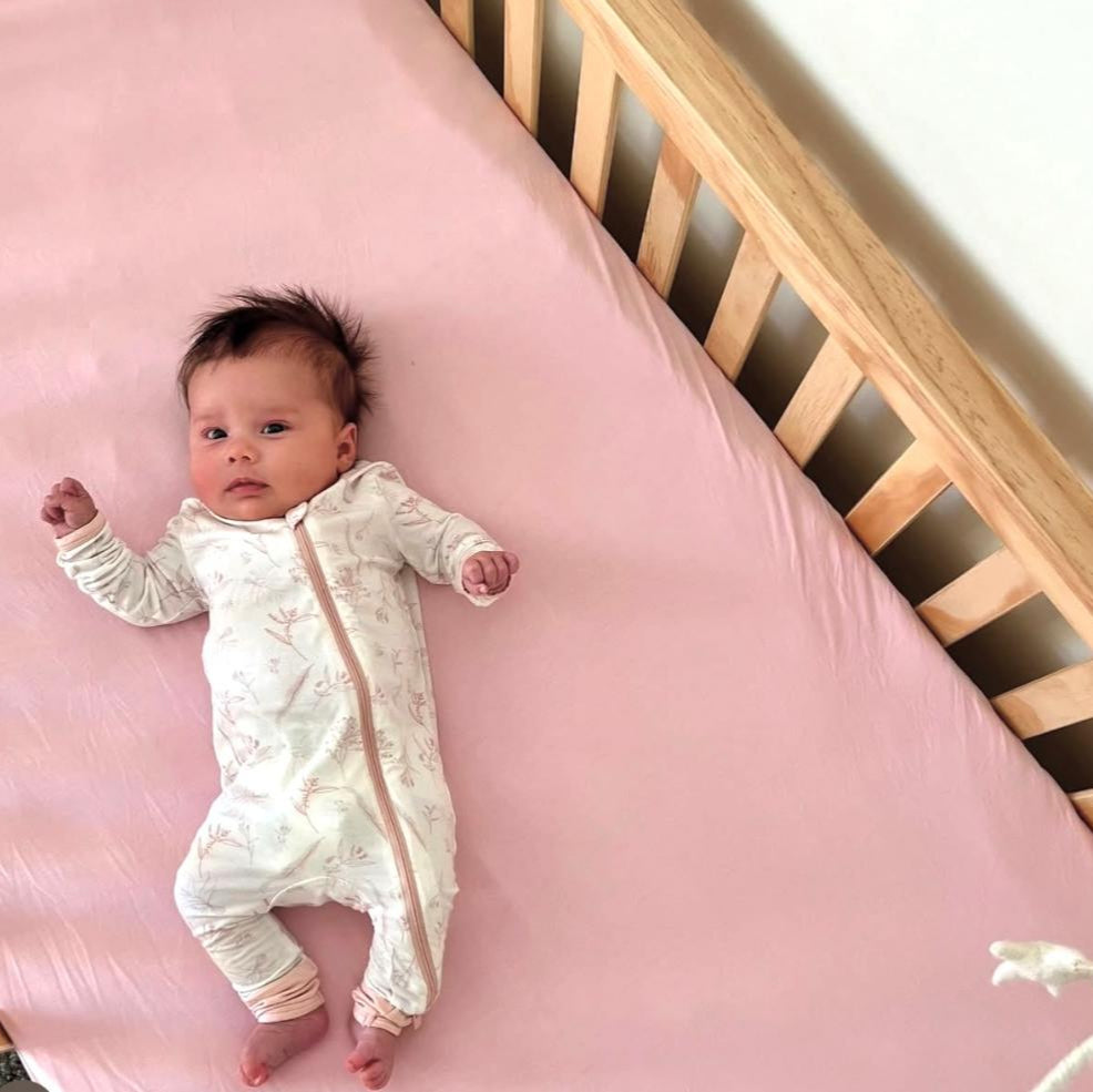 Earthly Threads Organic Bamboo Crib Sheet in soft pink, made for delicate skin and eczema-prone babies. Made from 100% certified organic bamboo.