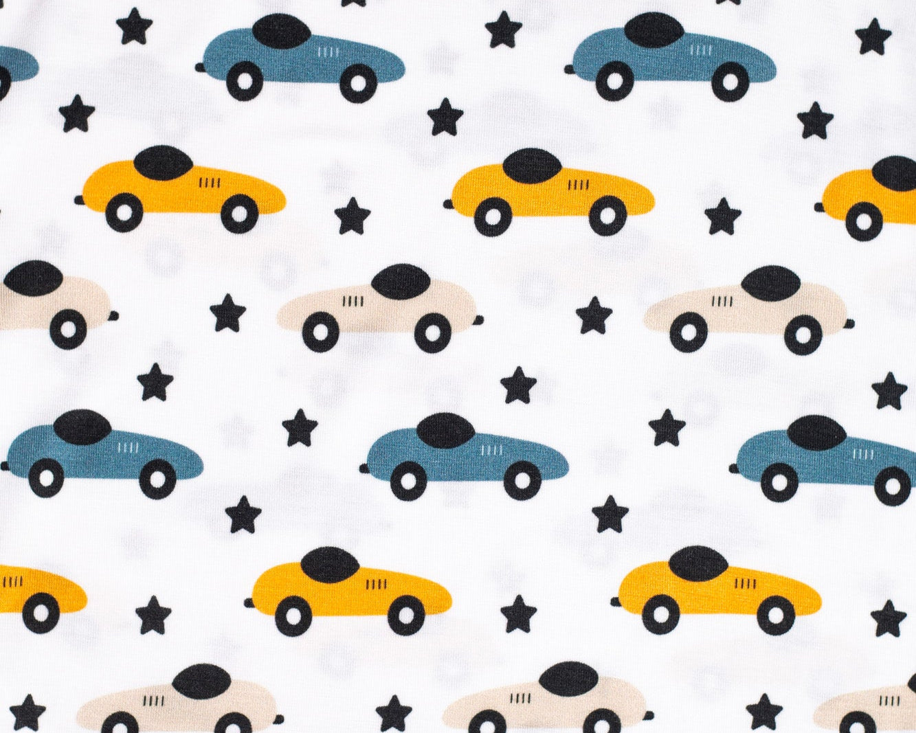 Eco-friendly bamboo pajama set with a fun race car and star pattern, designed for bedtime adventures.