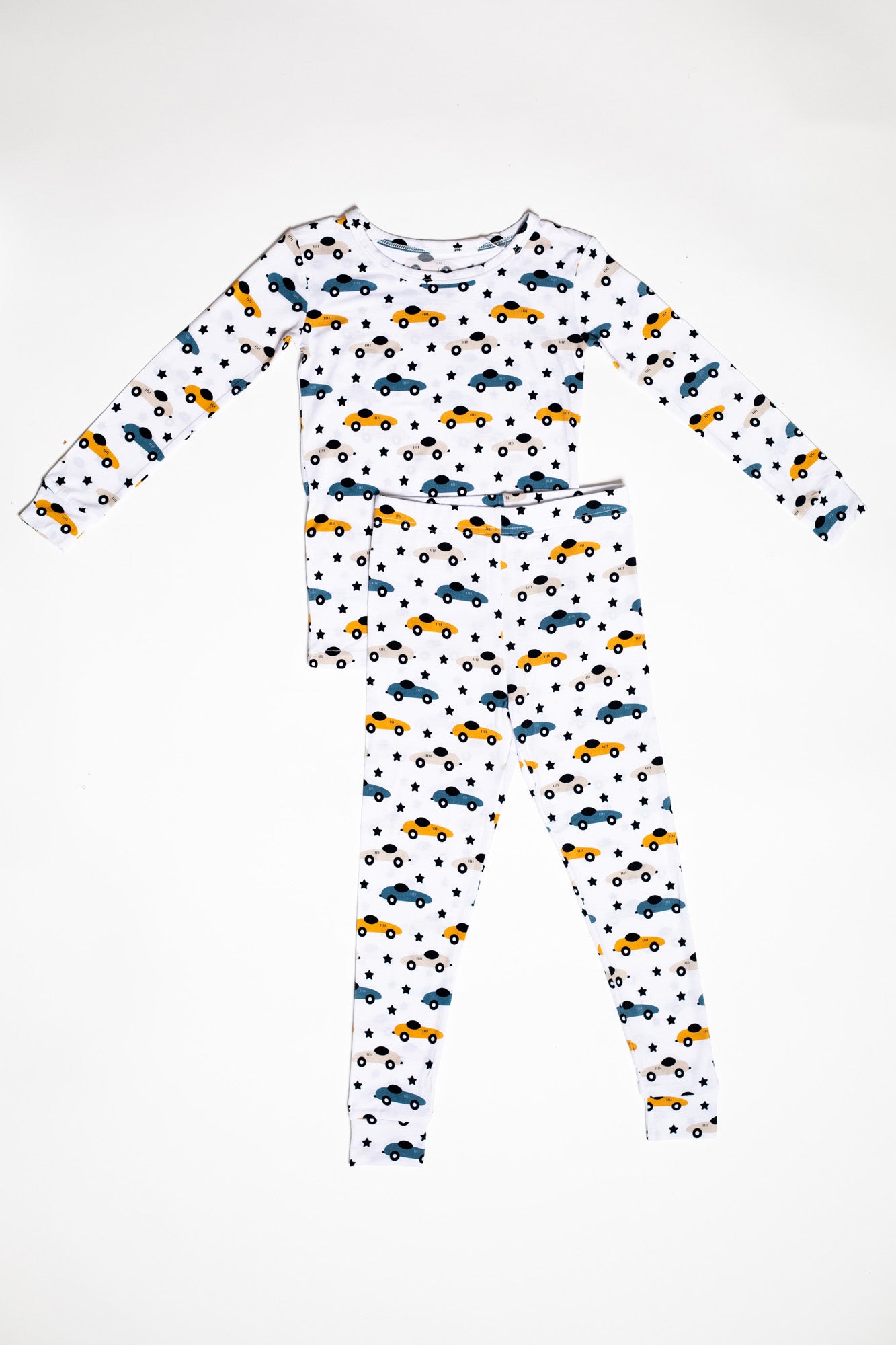 Race car bamboo pajama set with a fun pattern of race cars and shooting stars, designed for cozy, all-night comfort.