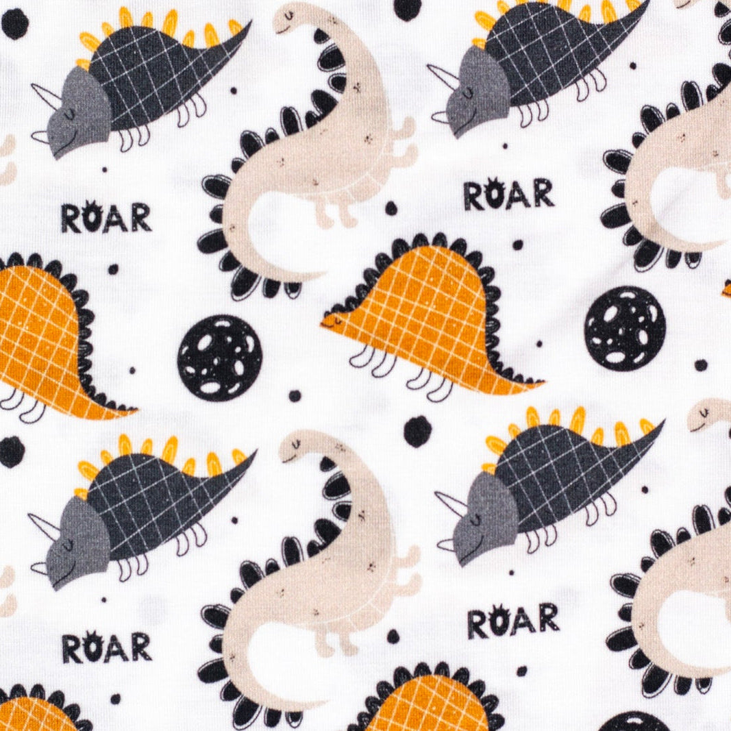 Buttery soft short sleeve pajama set featuring playful dinosaurs for bedtime fun.