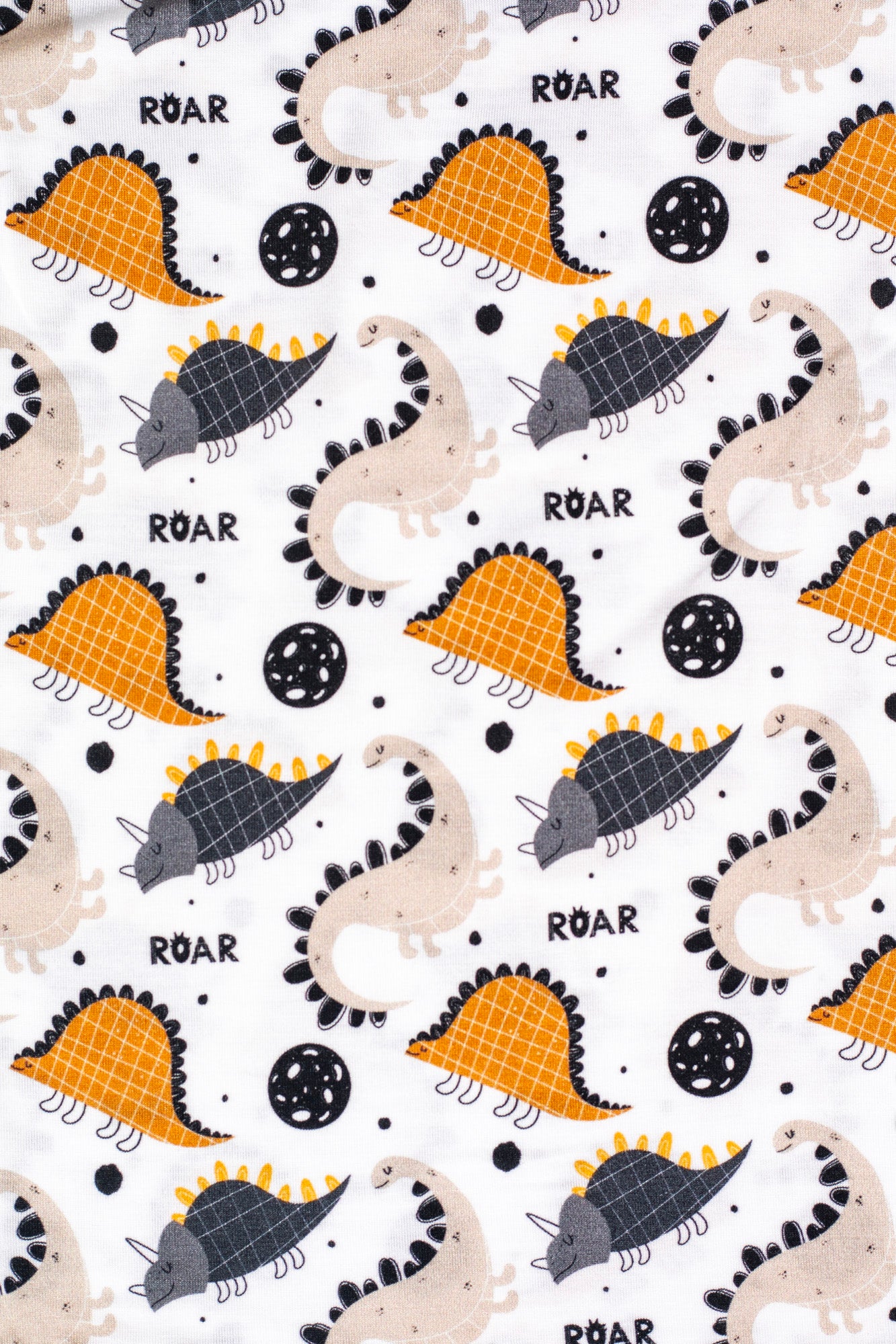 Buttery soft short sleeve pajama set featuring playful dinosaurs for bedtime fun.
