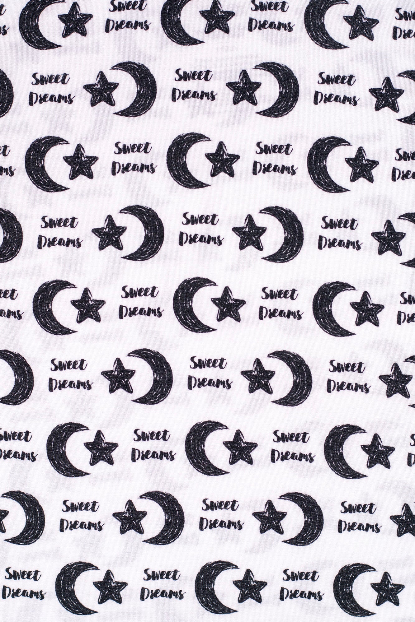 Earthly Threads incredibly soft short sleeve pajama set with moon and stars, alongside the words “Sweet Dreams”.